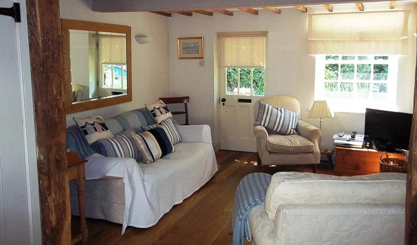 cosy sitting room with tv at September cottage