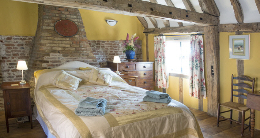 Kingsized bedroom at Leman Cottage, Suffolk